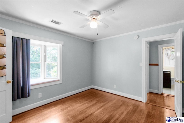 23 Mcrae Rd, Cheraw, SC 29520 - unfurnished room with a ceiling fan, wood finished floors, and ornamental molding