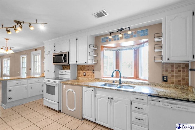 23 Mcrae Rd, Cheraw, SC 29520 - kitchen with white appliances, open shelves, white cabinetry, plenty of natural light, and crown molding
