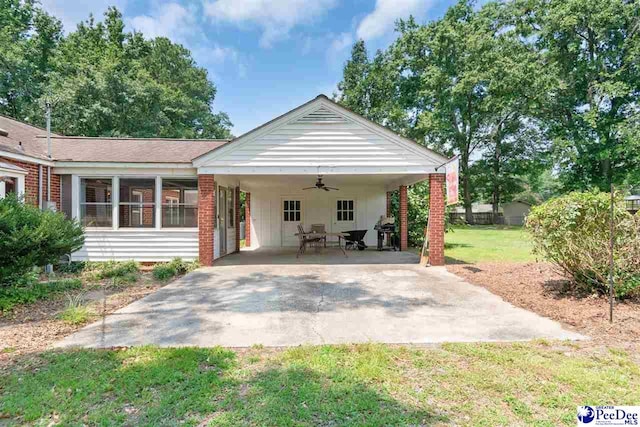23 Mcrae Rd, Cheraw, SC 29520 - view of front of home featuring ceiling fan, a front yard, and an attached carport