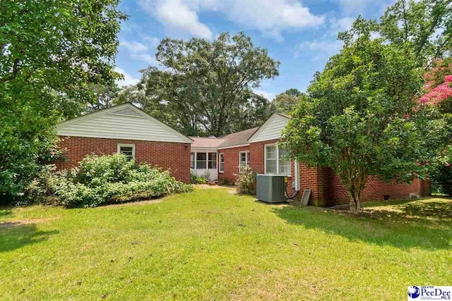 23 Mcrae Rd, Cheraw, SC 29520 - rear view of house featuring brick siding and a yard