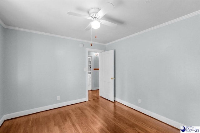 23 Mcrae Rd, Cheraw, SC 29520 - spare room featuring wood finished floors, ornamental molding, and a ceiling fan