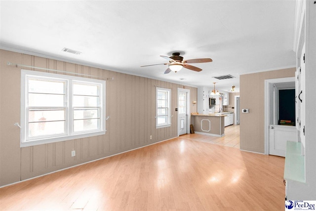 23 Mcrae Rd, Cheraw, SC 29520 - unfurnished living room featuring light wood-style floors, a ceiling fan, and ornamental molding