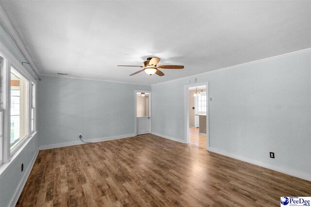 23 Mcrae Rd, Cheraw, SC 29520 - spare room with a ceiling fan, wood finished floors, and ornamental molding