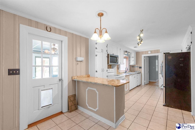 23 Mcrae Rd, Cheraw, SC 29520 - kitchen featuring light tile patterned flooring, a peninsula, appliances with stainless steel finishes, ornamental molding, and white cabinetry