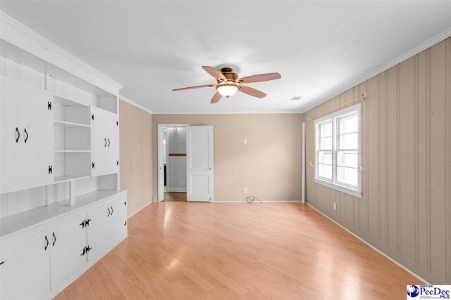 23 Mcrae Rd, Cheraw, SC 29520 - spare room featuring a ceiling fan, light wood-style floors, and crown molding