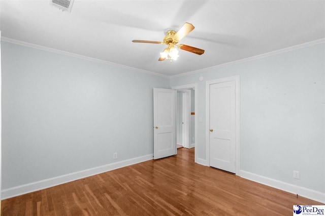 23 Mcrae Rd, Cheraw, SC 29520 - empty room featuring a ceiling fan, crown molding, and wood finished floors