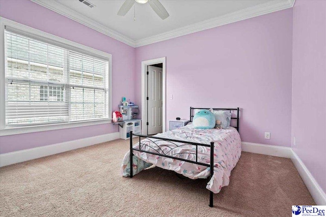 bedroom with baseboards, carpet flooring, and crown molding