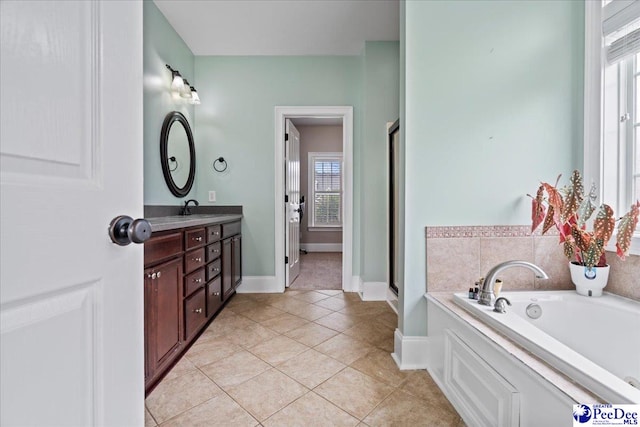 full bath with tile patterned flooring, a stall shower, a bath, and vanity