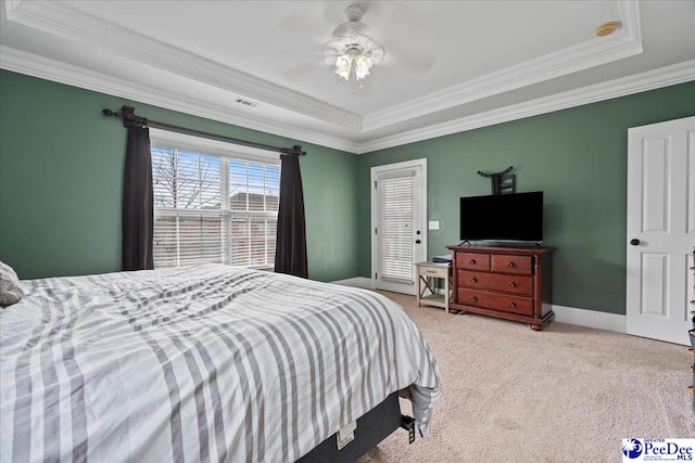 bedroom featuring visible vents, crown molding, baseboards, carpet floors, and a ceiling fan