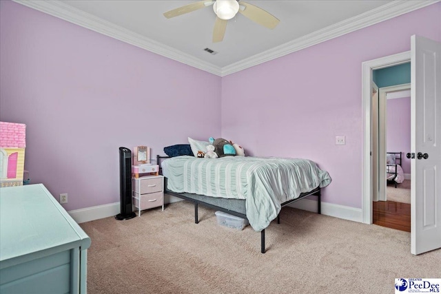 bedroom featuring crown molding, carpet, baseboards, and visible vents