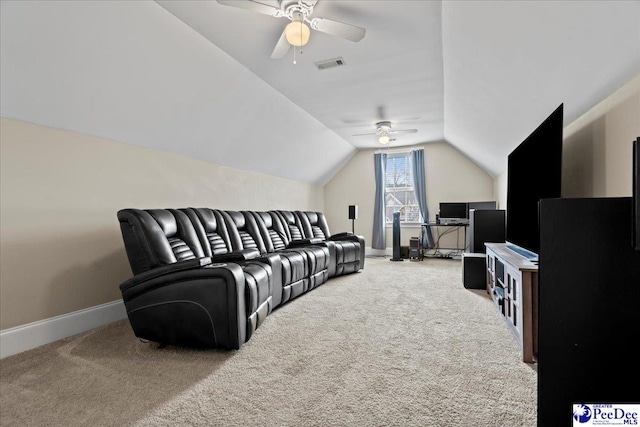 carpeted cinema featuring visible vents, baseboards, ceiling fan, and vaulted ceiling