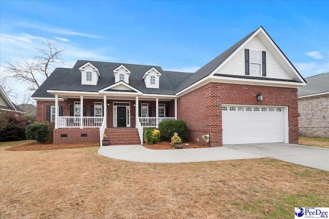 view of front facade featuring brick siding, concrete driveway, a front yard, covered porch, and a garage