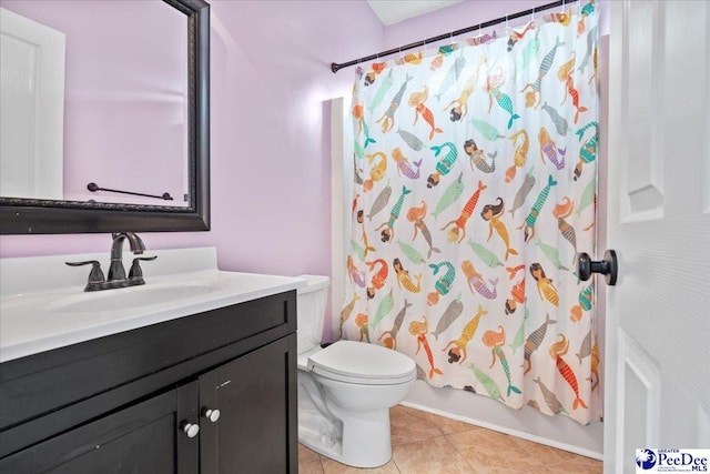 full bathroom featuring tile patterned floors, toilet, vanity, and shower / bath combination with curtain