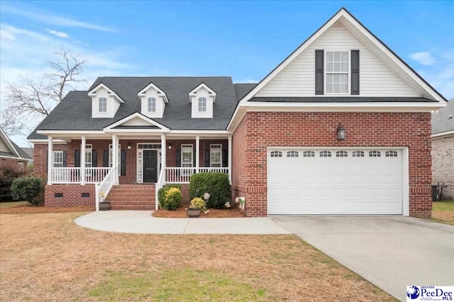 view of front of house with brick siding, a porch, a front yard, crawl space, and driveway