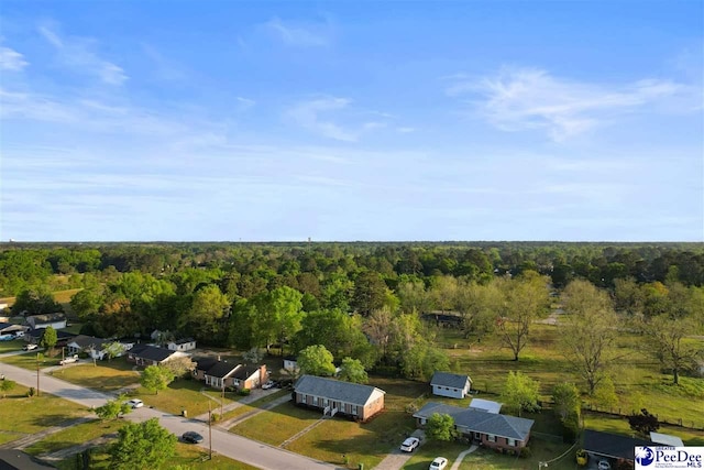 bird's eye view featuring a forest view