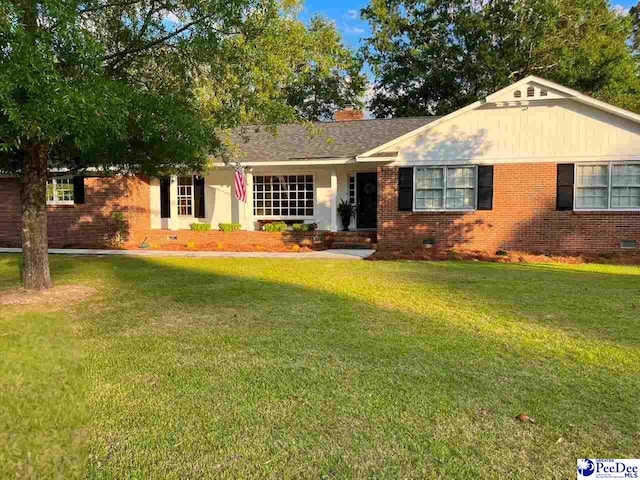 single story home with a front yard