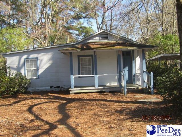 112 N Carolina Ct, Dillon, SC 29536 - view of front of house with a porch