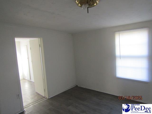 112 N Carolina Ct, Dillon, SC 29536 - unfurnished room featuring dark wood finished floors