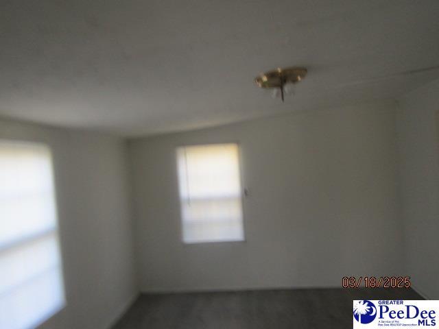 112 N Carolina Ct, Dillon, SC 29536 - spare room featuring carpet flooring