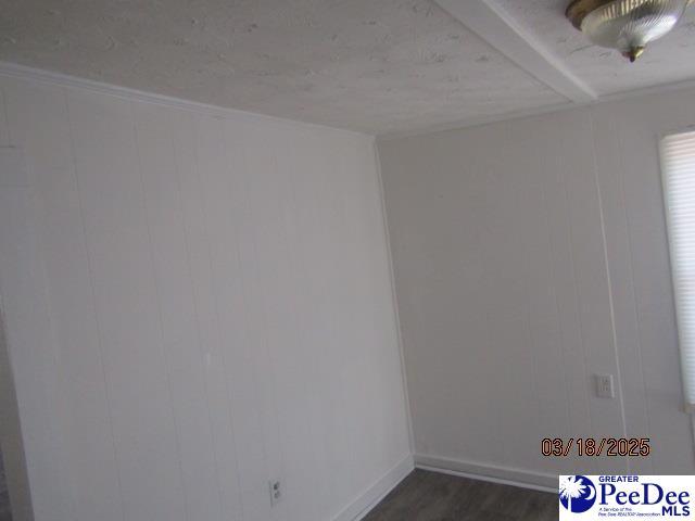 112 N Carolina Ct, Dillon, SC 29536 - spare room with dark wood-style flooring and baseboards