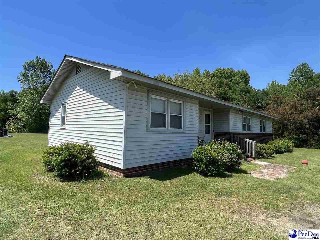 305 Tec Rd, Tract A, Cheraw, SC 29520 - view of side of home with a lawn