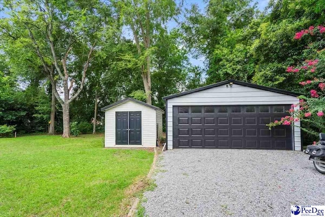 116 Moore St, Bennettsville, SC 29512 - detached garage featuring a shed