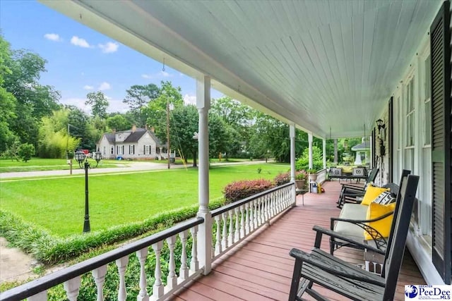 116 Moore St, Bennettsville, SC 29512 - porch with a yard and view of wooded area