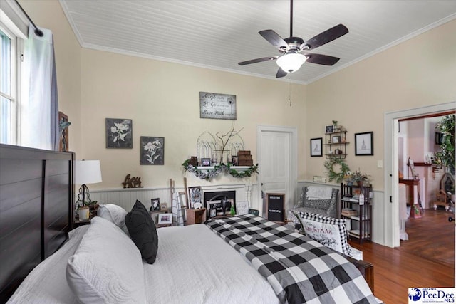 116 Moore St, Bennettsville, SC 29512 - bedroom featuring wood finished floors, crown molding, a fireplace, and ceiling fan