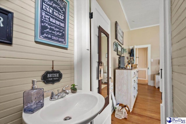 116 Moore St, Bennettsville, SC 29512 - bathroom with wood walls, ornamental molding, and wood finished floors