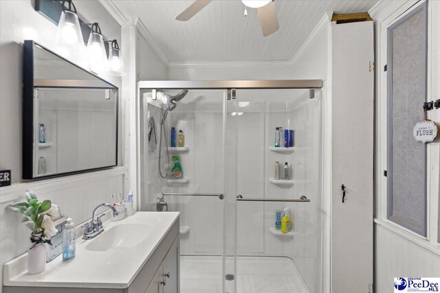 116 Moore St, Bennettsville, SC 29512 - bathroom with vanity, a shower stall, ceiling fan, and ornamental molding