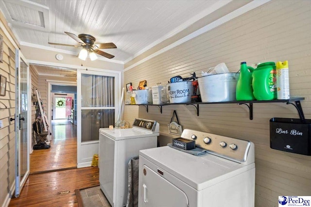116 Moore St, Bennettsville, SC 29512 - laundry room with washing machine and clothes dryer, wood walls, ceiling fan, hardwood / wood-style floors, and ornamental molding