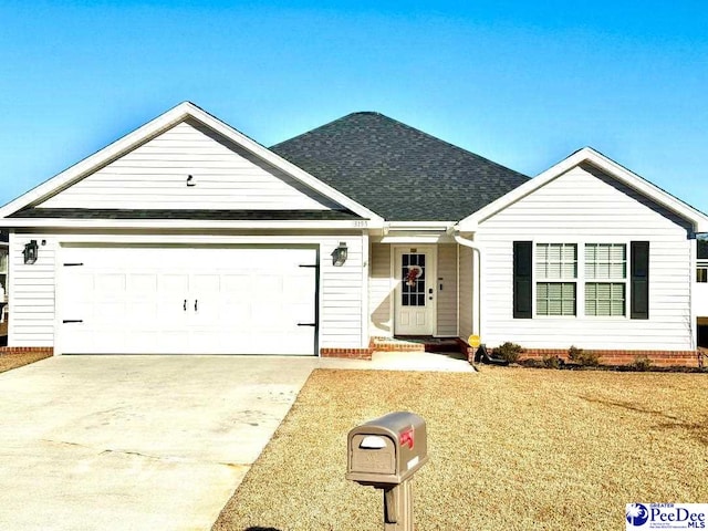 ranch-style home featuring a garage