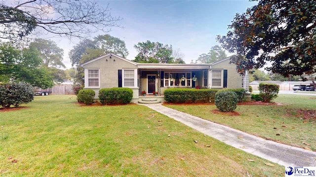 310 S Calhoun Dr, Florence, SC 29501 - view of front of property featuring a front lawn and a porch