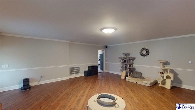 310 S Calhoun Dr, Florence, SC 29501 - miscellaneous room with wood finished floors, baseboards, ornamental molding, and visible vents