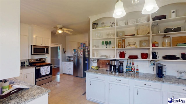 310 S Calhoun Dr, Florence, SC 29501 - kitchen featuring stainless steel appliances, white cabinetry, and ceiling fan