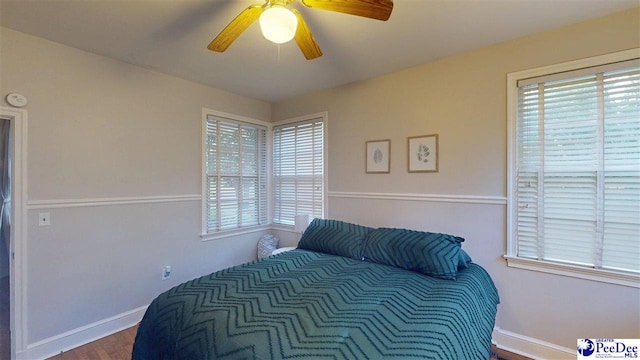 310 S Calhoun Dr, Florence, SC 29501 - bedroom with ceiling fan, baseboards, and dark wood finished floors