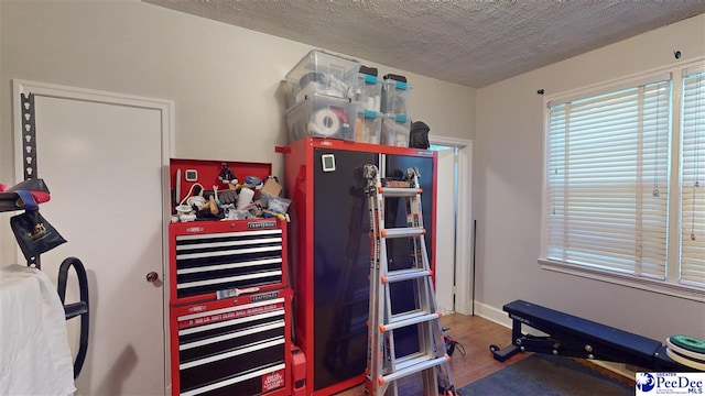 310 S Calhoun Dr, Florence, SC 29501 - miscellaneous room featuring a textured ceiling, wood finished floors, and baseboards