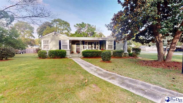 310 S Calhoun Dr, Florence, SC 29501 - view of front facade with a front lawn