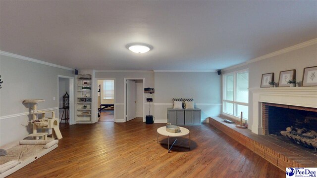 310 S Calhoun Dr, Florence, SC 29501 - living area featuring ornamental molding, a brick fireplace, wood finished floors, and built in features