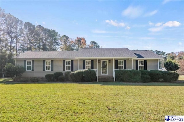 ranch-style house featuring a front lawn