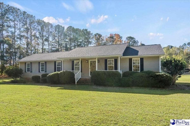 ranch-style home with a front lawn