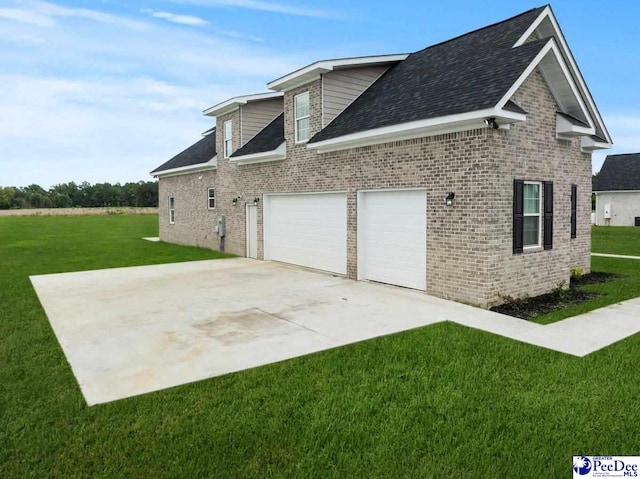 1613 Timmonsvillel Hwy, Darlington, SC 29532 - view of side of home featuring brick siding, a yard, driveway, roof with shingles, and a garage