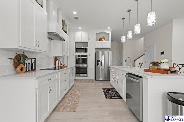 1613 Timmonsvillel Hwy, Darlington, SC 29532 - kitchen featuring appliances with stainless steel finishes, open shelves, wall chimney exhaust hood, white cabinets, and decorative backsplash