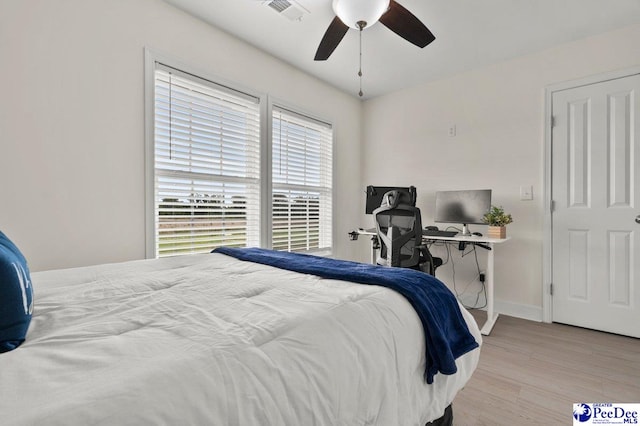1613 Timmonsvillel Hwy, Darlington, SC 29532 - bedroom featuring multiple windows, wood finished floors, and ceiling fan
