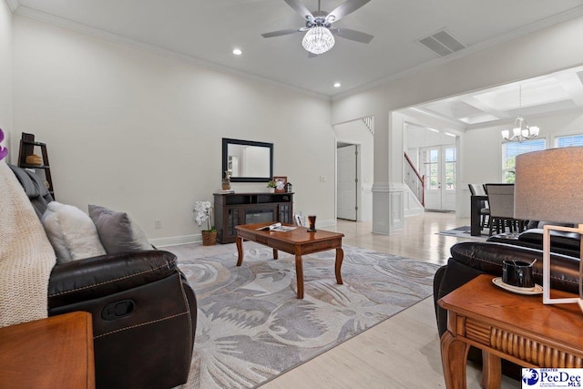 1613 Timmonsvillel Hwy, Darlington, SC 29532 - living room with crown molding, a chandelier, ceiling fan, light wood finished floors, and stairway
