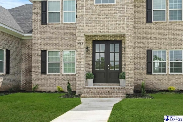 1613 Timmonsvillel Hwy, Darlington, SC 29532 - entrance to property featuring french doors, a lawn, and brick siding