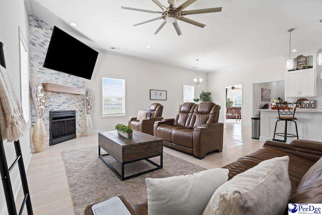1613 Timmonsvillel Hwy, Darlington, SC 29532 - living area with a ceiling fan, a fireplace, recessed lighting, light wood-type flooring, and a chandelier