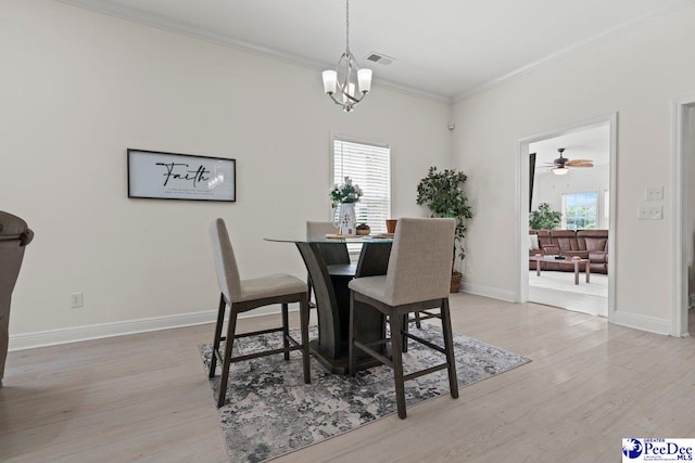 1613 Timmonsvillel Hwy, Darlington, SC 29532 - dining room featuring light wood-type flooring, ornamental molding, a chandelier, and a ceiling fan