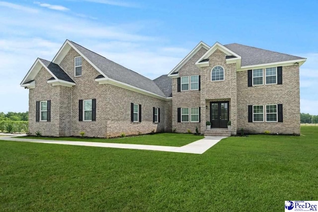 1613 Timmonsvillel Hwy, Darlington, SC 29532 - view of front facade with french doors, a front lawn, brick siding, and a shingled roof
