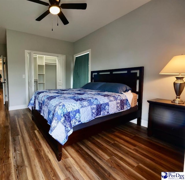 bedroom with a closet, ceiling fan, baseboards, and wood finished floors